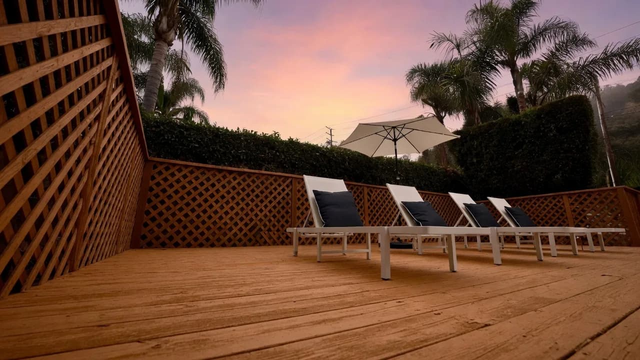 Loungers on the Truth House deck at sunset.