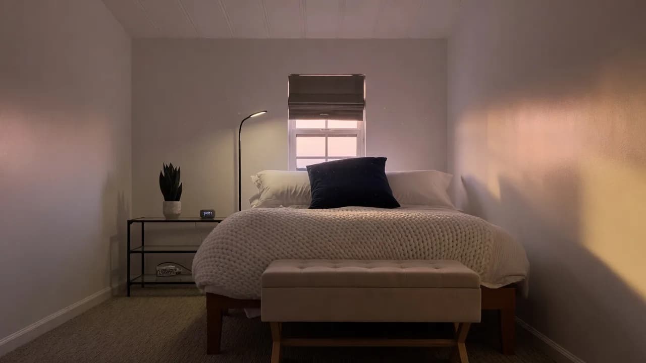 A room at The Truth House at dusk, window to the canyon.